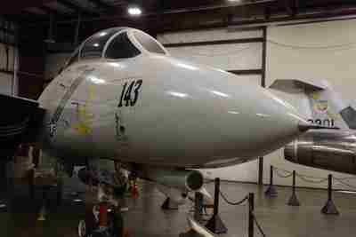 A jet fighter plane in an air museum.